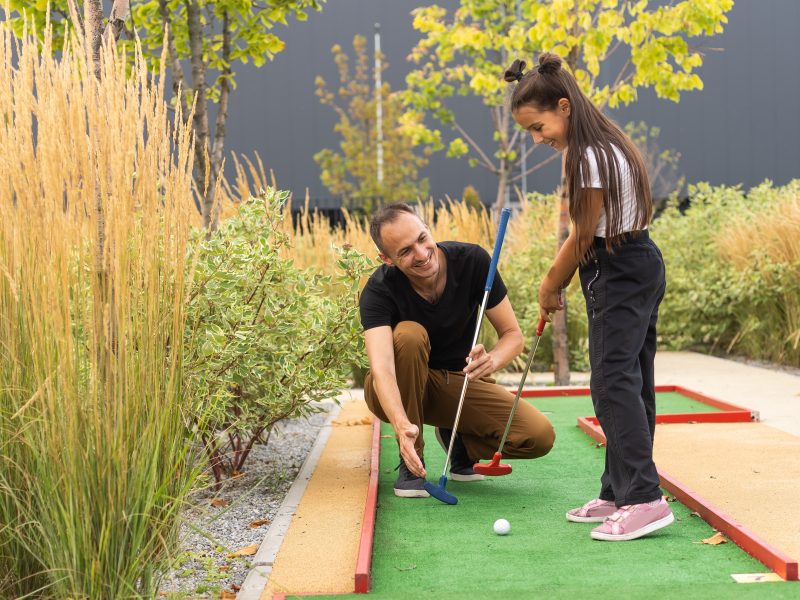 Father,And,Daughter,Playing,Mini,Golf