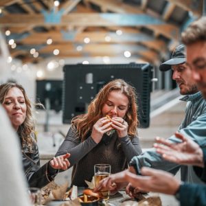 People eating on food on the driving range