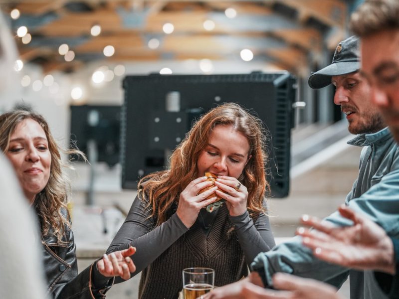 People eating on food on the driving range