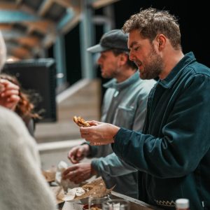 People eating food on the driving range