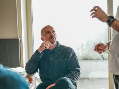 Two men stood talking