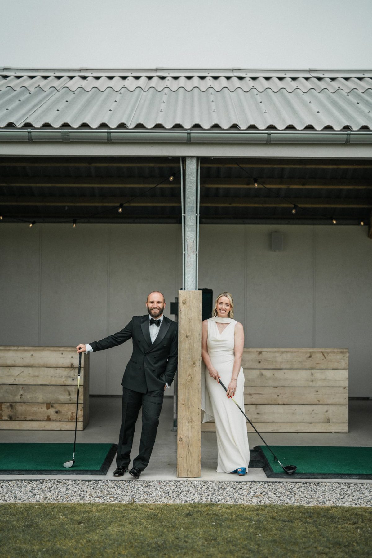 Two people stood on driving range