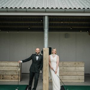 Two people stood on driving range