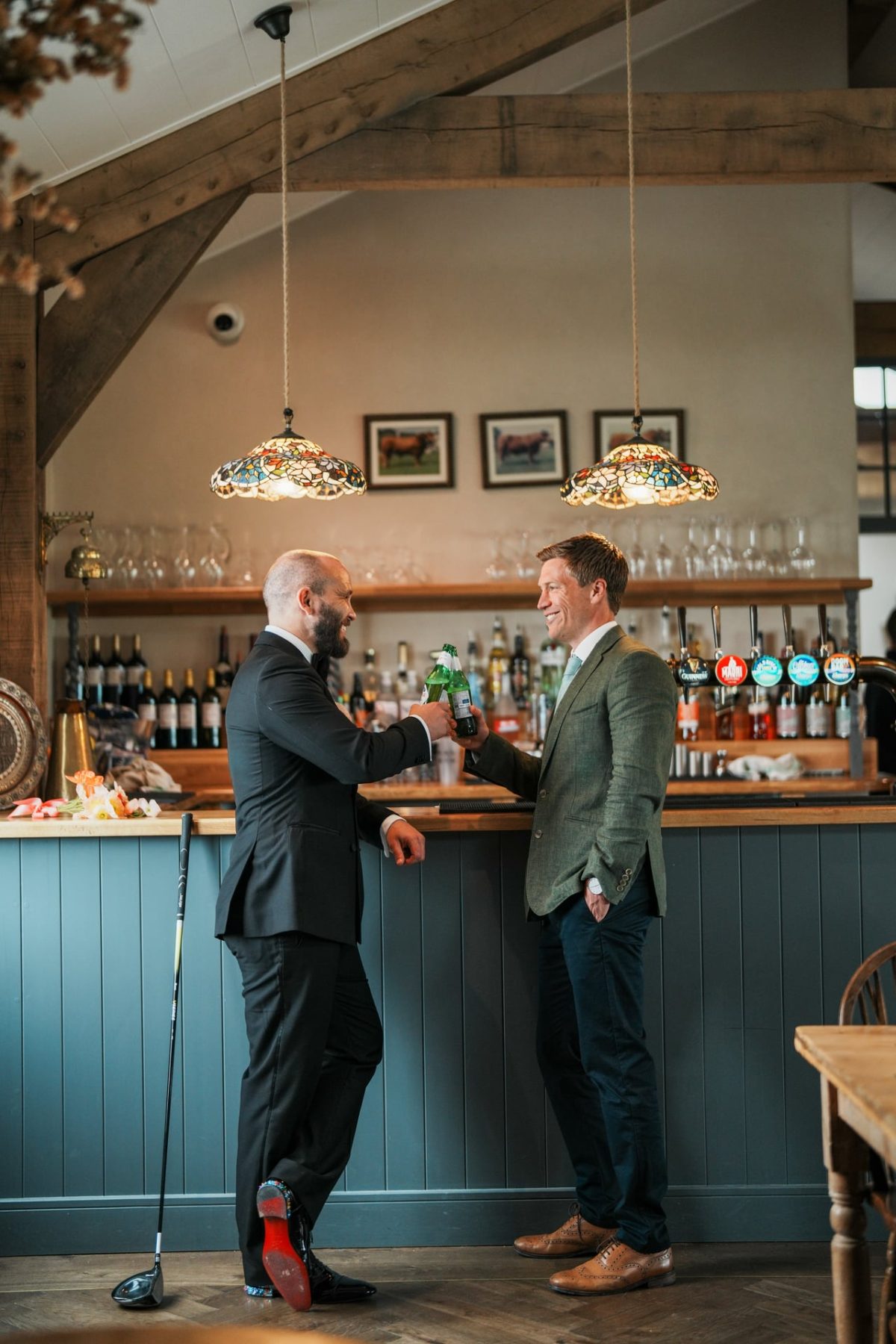 Two men stood at bar